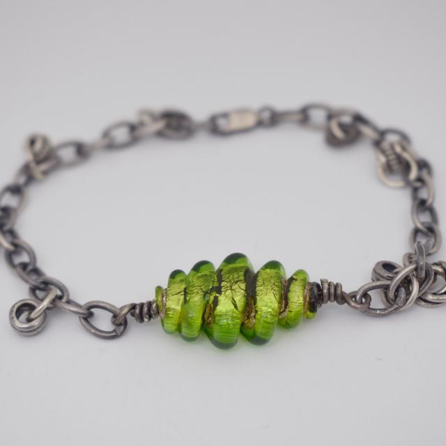 Green lampwork sterling silver charm bracelet.jpg